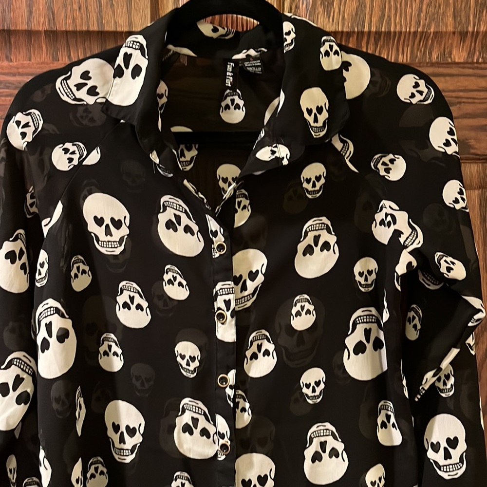 Fun & Flirt Long Sleeve Black with white smiling skulls sheer blouse. Size Small
